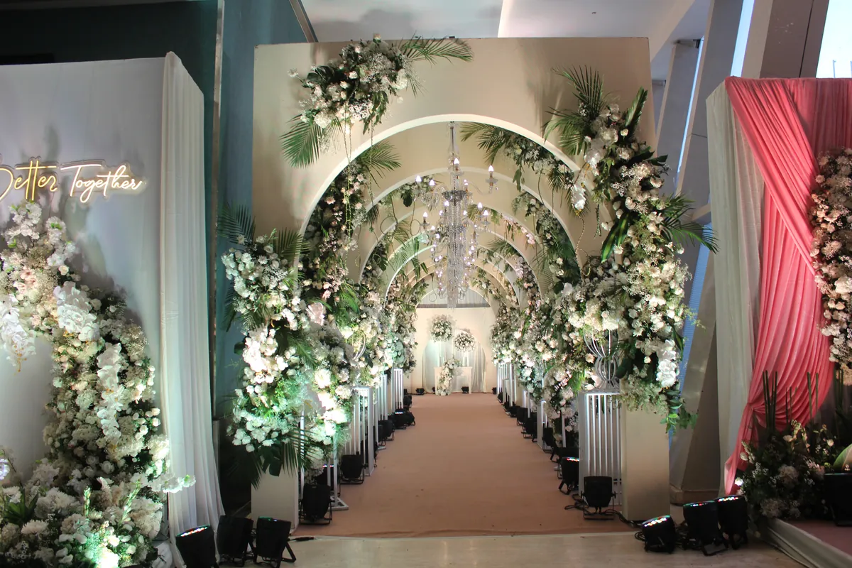 A floral arch by Minnt Green Decor